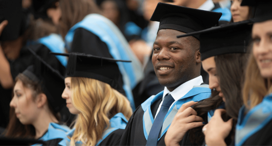 Students at graduation in caps and gowns