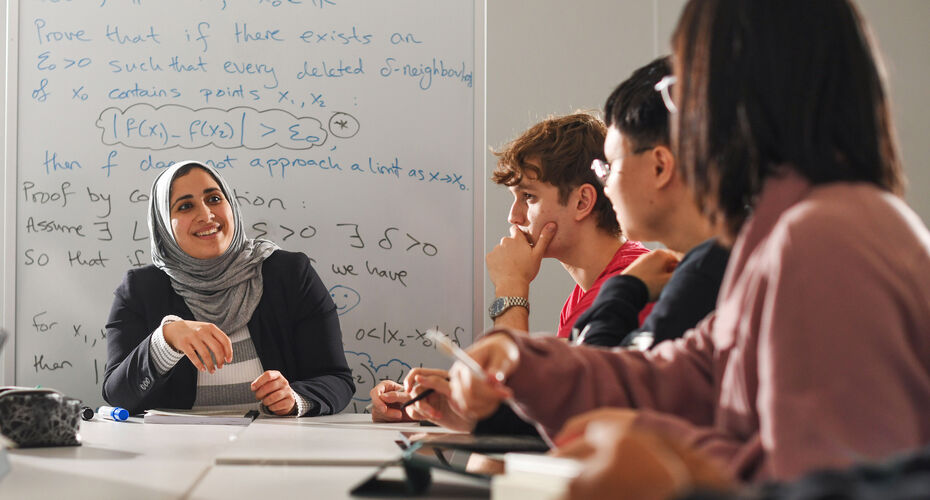 A lecturer talking to students in class
