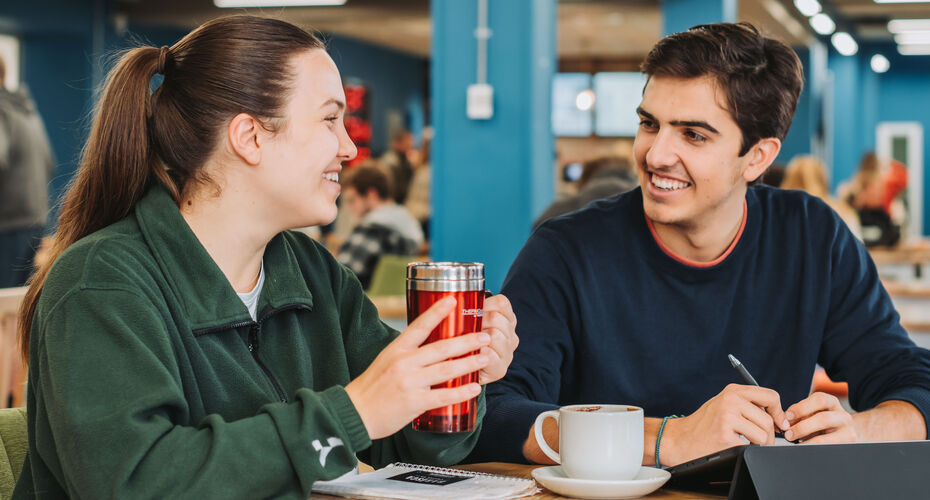Students talking in a cafe