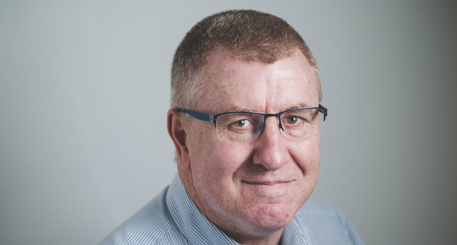 Headshot of Gordon Brown with grey background