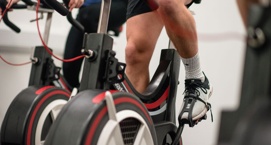 student using exercise bike