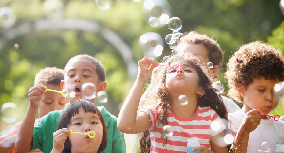 Children blowing bubbles