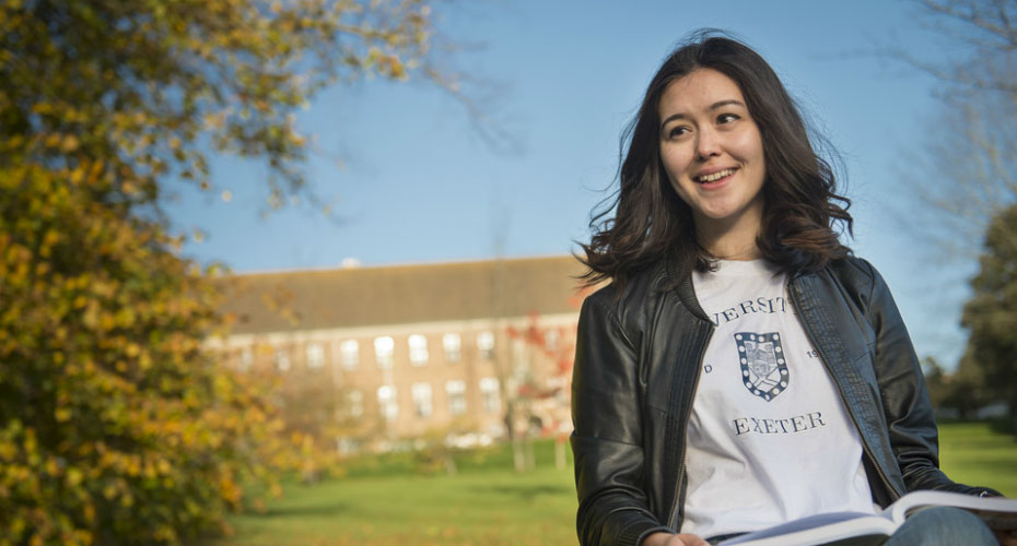 Female student reading outside Mardon