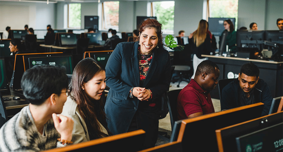 Teacher speaking to students in new computer lab